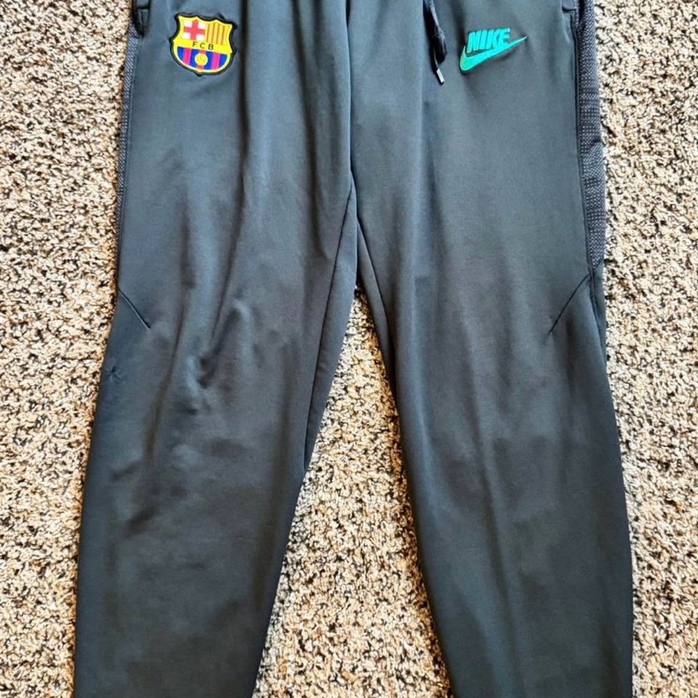 Nike Men’s Green Soccer pants with Teal and Multicolor Accents